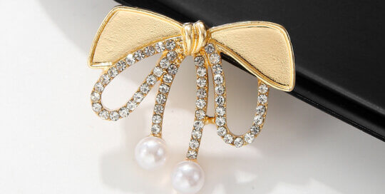 Wholesale Bow Brooch with Rhinestones and Pearls – Elegant Women’s Accessory