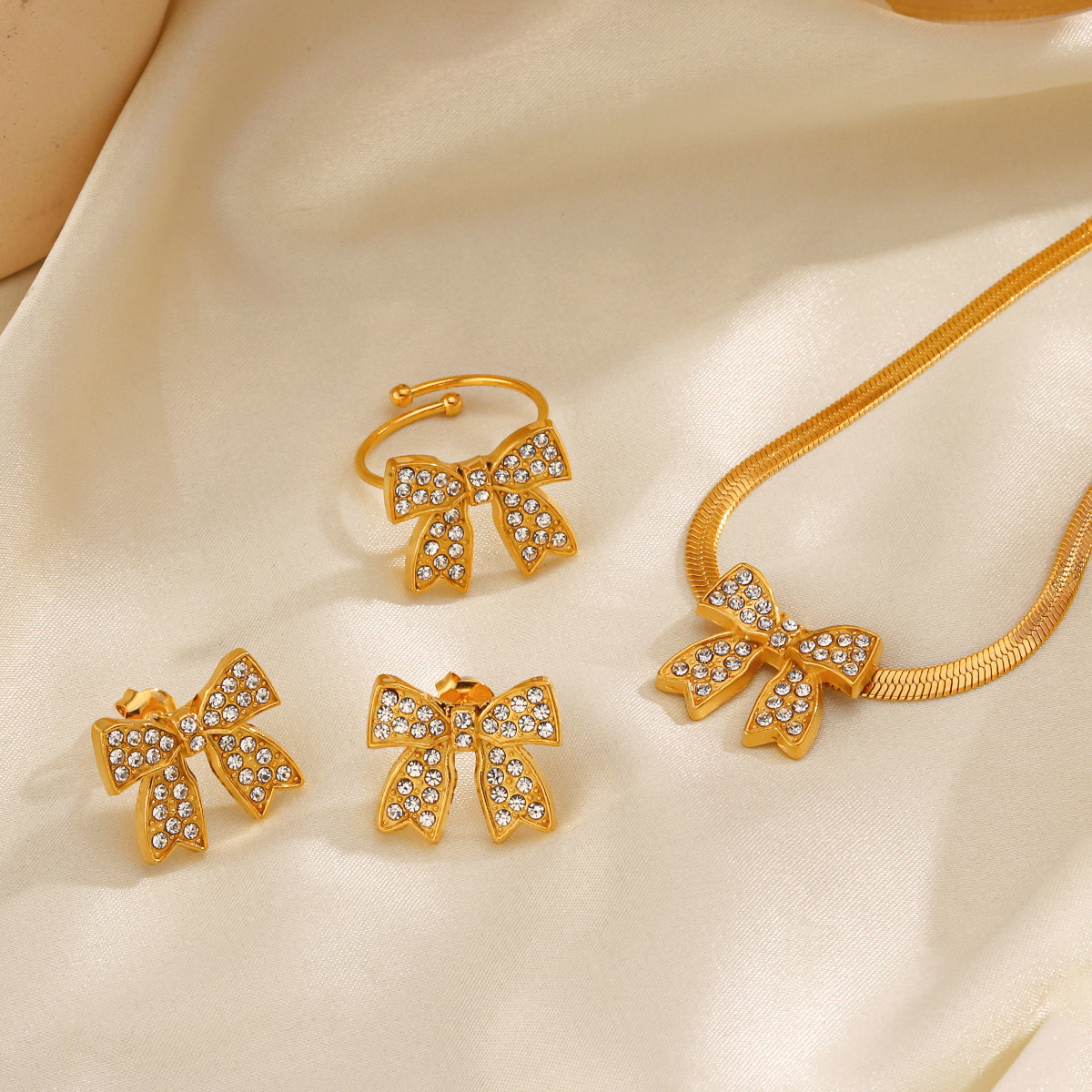 Adjustable gold stainless steel bow ring with rhinestones for women, wholesale fashion jewelry