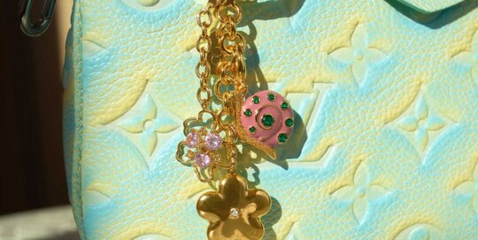 Gold stainless steel flower and candy bag charm with rhinestones