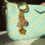 Gold stainless steel flower and candy bag charm with rhinestones