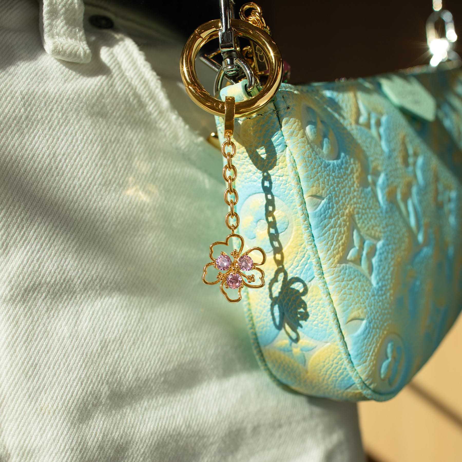 Gold stainless steel flower and candy bag charm with rhinestones