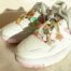 Decorative stainless steel shoe charms with butterfly, cherry, mushroom, and flower enamel pendants on sneakers