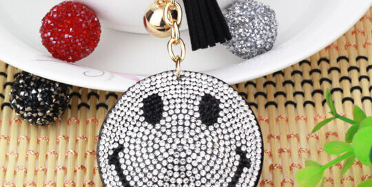 Smiley face rhinestone keychain with tassel and gold chain