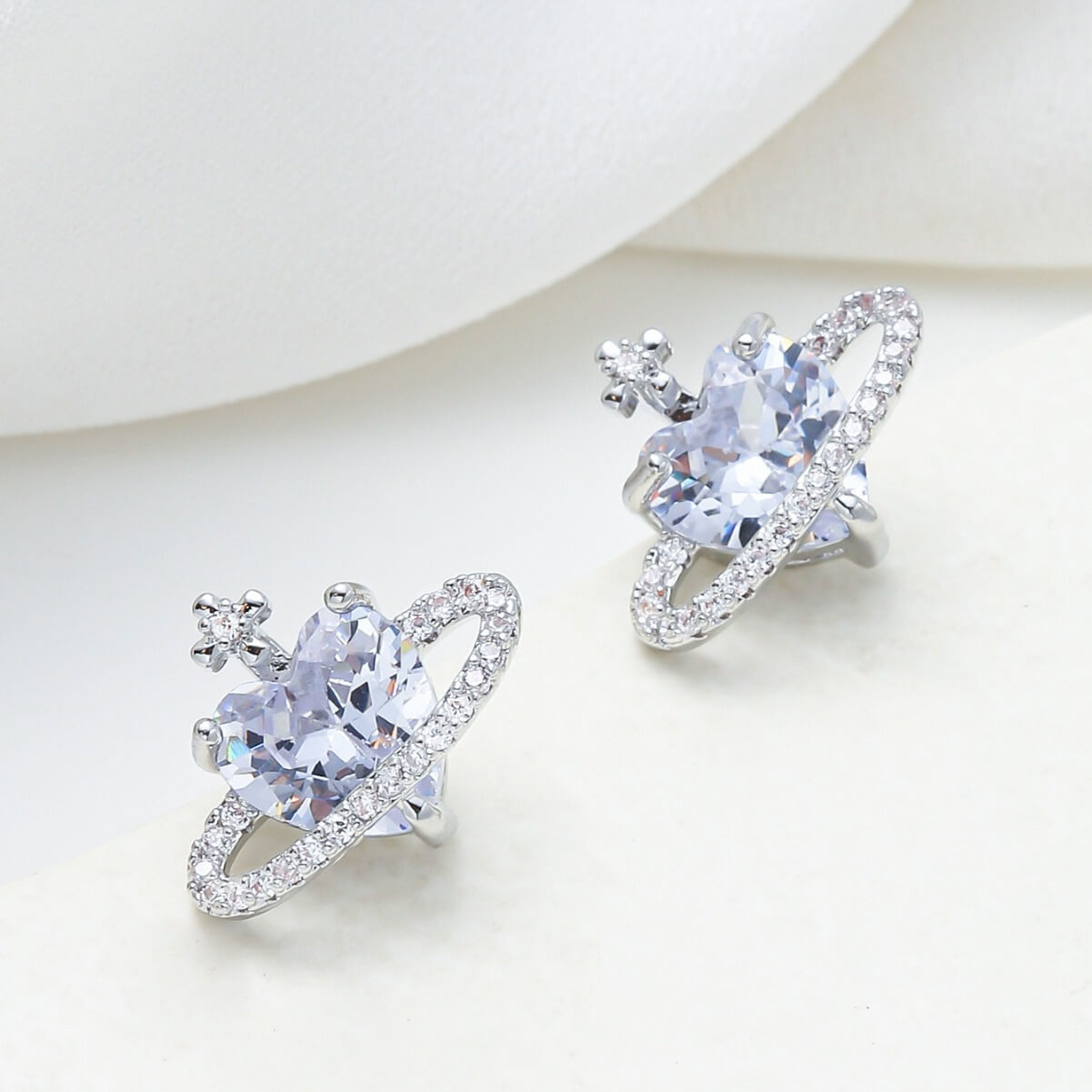Heart planet cubic zirconia satellite stud earrings in silver – hypoallergenic wholesale jewelry