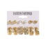 Gold hoop and stud earrings set with crystal and heart designs