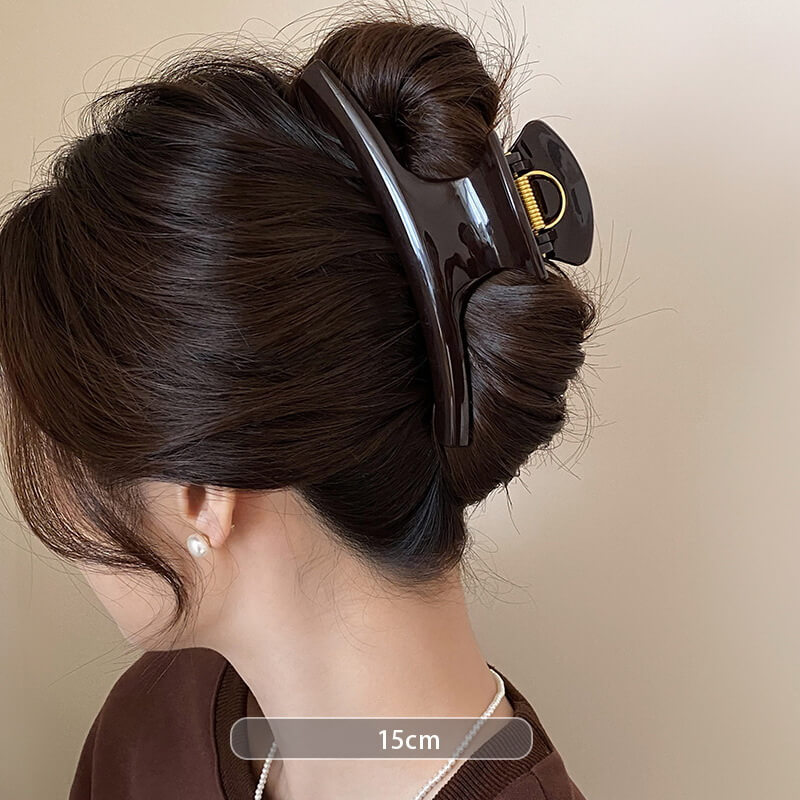 large tortoiseshell hair claw clip worn in updo hairstyle